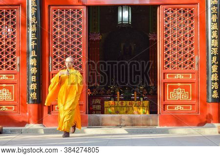 Buddhist Monk Performing Ritual At Fayuan Temple In Beijing, China