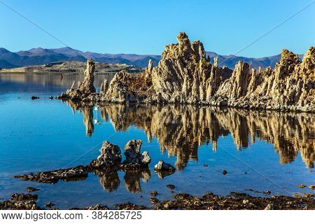 Twilight evening. California, USA. Picturesque Mono lake. The columns - remains of 