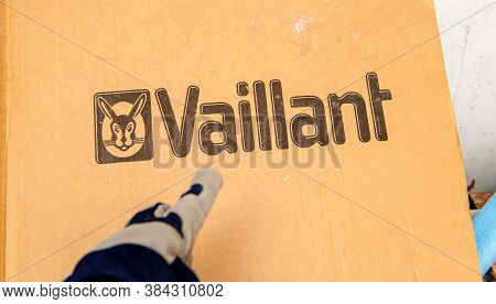 Paris, France - Aug 14, 2020: Installer Hand Pointing To Vaillant Gas Boiler Heating System During I