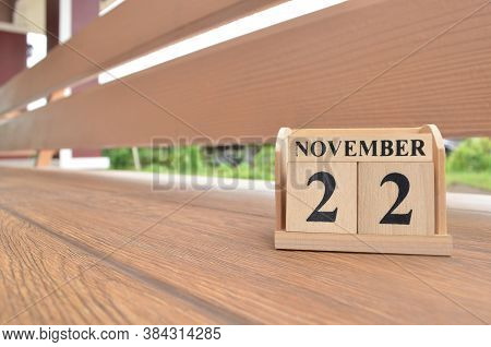 November 22, Number Cube With Wooden Balcony Background.