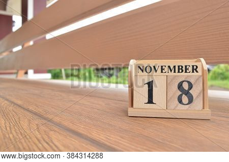 November 18, Number Cube With Wooden Balcony Background.