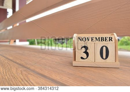 November 30, Number Cube With Wooden Balcony Background.