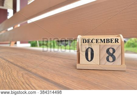 December 8, Number Cube With Wooden Balcony Background.