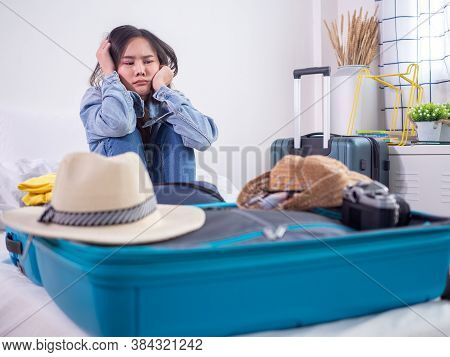 Asian Women Are Sitting In A Sad Mood After Pack A Bag Of Clothes And Hesitant To Hang Out For Fear 