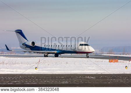 Private Plane On The Main Taxiway At Winter Airport
