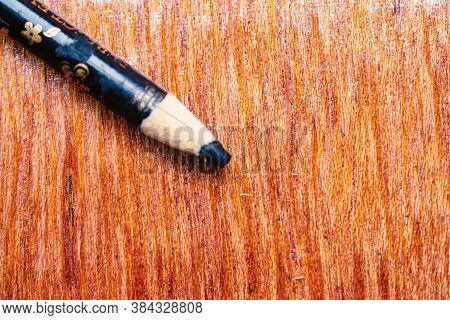Black Eyeliner Pencil, Known As `kajal` In India, Sharpened And Put On The Wooden Dressing Table. Cl