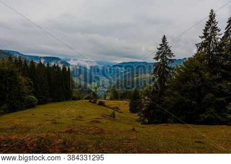 Ukrainian Picturesque Carpathian Village Luhy, Located At The Foot Of Many Mountains And Near The Ri