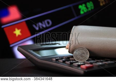 Two Hundred Vietnam Dong Coin On Obverse (vnd) On Black Calculator And Wallet With Digital Board Of 