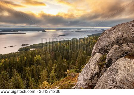 Beautiful nature landscape in Koli national park during ruska season in Finland. Pine forest and lake landscape at sunrise