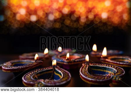 Indian Festival Diwali, Diya Oil Lamps Lit On Colorful Rangoli. Hindu Traditional. Happy Deepavali. 