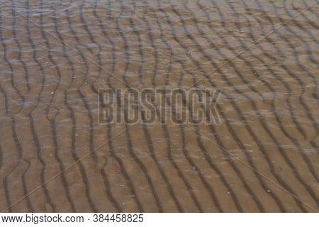 Waved Sand Texture Lines Under Sea Water