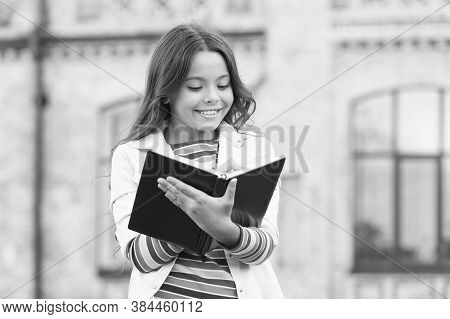 Access To Much More Than Just Book. Knowledge Concept. Little Girl Hold Book. Girl With Book School 