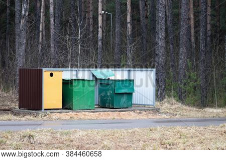 Overfilled Trash Of Large Wheelie Bins For Rubbish, Recycling And Garden Waste