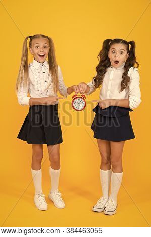 It Is Time. School Schedule. Schoolgirls And Alarm Clock. Children School Pupils. Knowledge Day. Sch