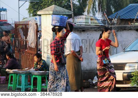 Yangon, Myanmar, Feb 24, 2019: Myanmese Woman With Thanakha (myanmar Powder) On Their Face Put The P