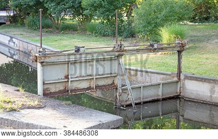 Regulating The Waterways In Colmar, France: Old Metal Lock