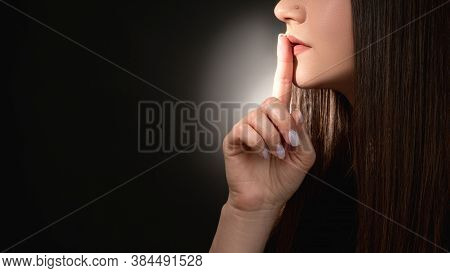 Stop Talking. Domestic Violence. Mysterious Woman Asking To Keep Quiet With Finger On Lips Isolated 