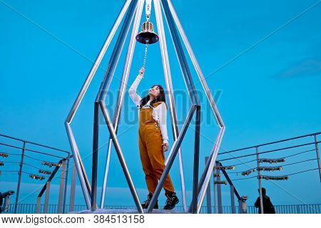 Sapporo, Hokkaido, Japan - December 2019 : A Woman Ringing The Bell At Top Of Mt. Moiwa In Sapporo C