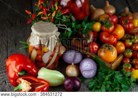 Tomatoes, Peppers, Onions On The Table. Preservation Of The Autumn Harvest Of Vegetables. Glass Jar 