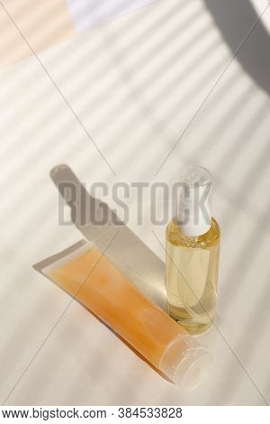 Spray Bottle Of Lotion And Natural Cream For Face In Light Background With Copy Space.