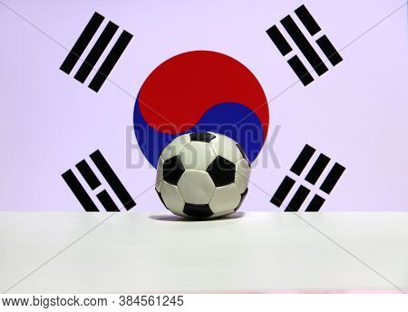 Small Football On The White Floor With Red And Blue Yin Yang And Four Black Trigrams Of South Korean