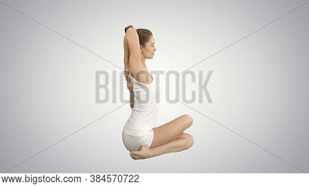 Yoga Or Pilates Exercise Without Mat Gomukasana, Cow Face Pose On Gradient Background.