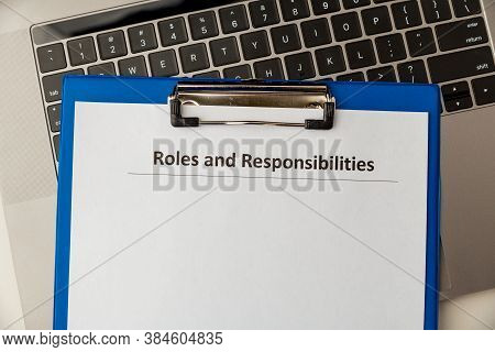 Roles And Responcibilities Document In The Tablet At The Desk.