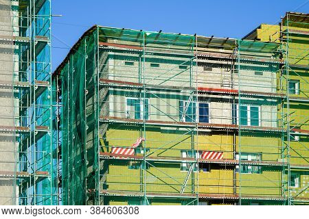 Scaffolding Arround The House To Install Thermal Insulation Of The Apartment Building Facade