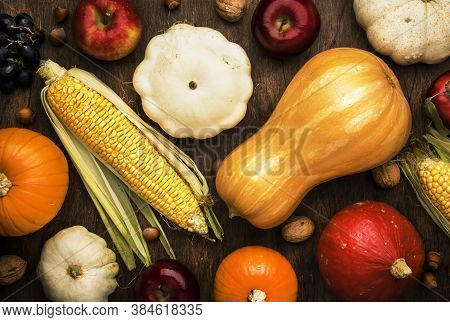 Thanksgiving Background, Food Autumn Harvest Concept. Rustic Table With Apples, Pumpkins, Nuts, Grap