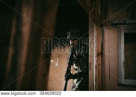 Soldier In Full Us Marsoc Equipment Entering Abandoned Building, Aiming Different Angles With Mk18 A