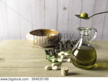 Woden Background And Bottle Of Fresh Oil