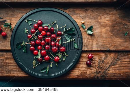 Ripe Cherries On A Black Dish. Cottagecore Aesthetics. Rustic, Vintage Style Harvest Season Concept