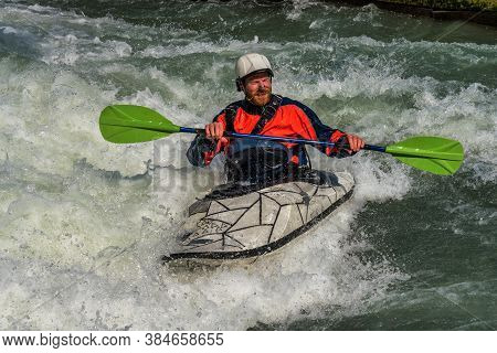 Augsburg, Germany - June 16, 2019: Whitewater Kayaking, Extreme Kayaking. A Guy In A Kayak Sails On 