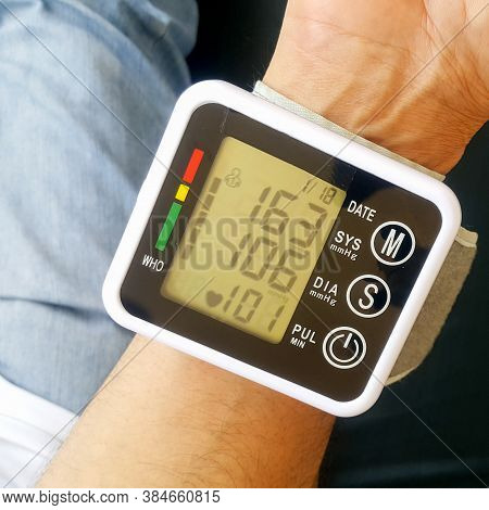 Measure Your Blood Pressure At Home Using A Portable Device To Check Your Health. The Device Shows A