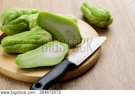 Chayote Squash Or Mirlition Squash On Wooden Board Preparing For Cooking