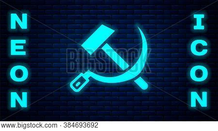 Glowing Neon Hammer And Sickle Ussr Icon Isolated On Brick Wall Background. Symbol Soviet Union. Vec