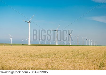 Offshore Windmill Park With Stormy Clouds And A Blue Sky, Windmill Park In The Ocean