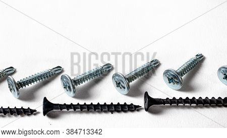 Self-cutters On A White Background Banner With Space For Text. Construction Tools, Self-tapping Scre