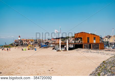 Urk Netherlands August 2020, Harbor And Lighthouse Near The Beach On A Bright Summer Day Flevoland U