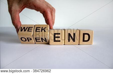 Hand Turns A Cube And Changes The Expression 'open-end' To 'weekend'. Beautiful White Background. Bu