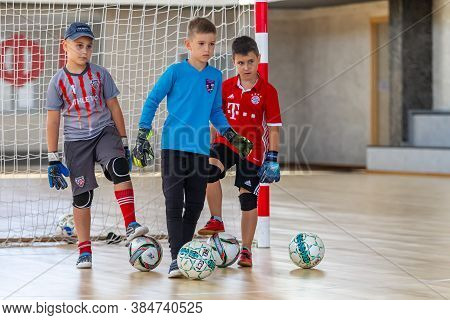 Odessa, Ukraine-circa-2020: Children Play Mini-football. Futsal Goalkeeper Stands At Gate. Sports Tr