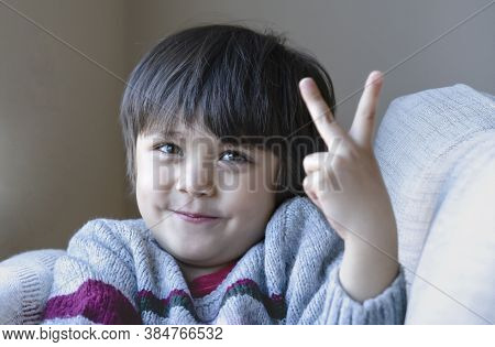 Portrait Cute Little Boy Looking At Camear With Smiling Face, Selective Focus Happy Kid Showing Two 