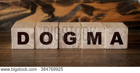Dogma Word In Wooden Cubes. Social Concept