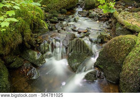 Long Exposure Of A Waterfall At Becky Falls In Dartmoor National Park