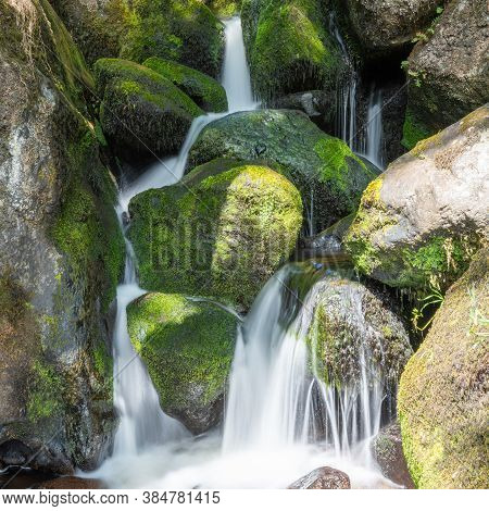 Long Exposure Of A Waterfall At Becky Falls In Dartmoor National Park