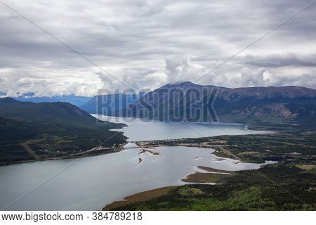 Beautiful View Of A Small Touristic Town, Carcross, Surounded By Canadian Mountain Landscape. Locate
