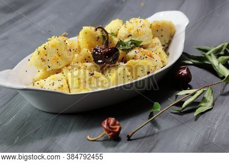Idli Fry Made From Fermented Rice And Urad Daal Cakes Called Idis On A Dark Background.
