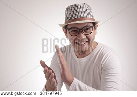 Young Asian Man Wearing White Shirt, Happy Proud Clapping Gesture.over Grey Background, Halfl Body P