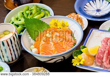 Salmon Sashimi With Salmon's Egg (ikura) In Bowl At Japanese Food Restaurant.