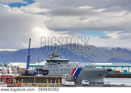 Reykjavik, Iceland- 27 August 2015: Port Buildings And Moored Boats In The Capital Town. Mountain In
